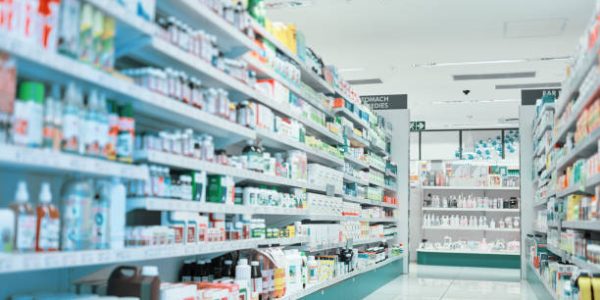 Cropped shot of fully stocked shelves in an aisle of a pharmacy